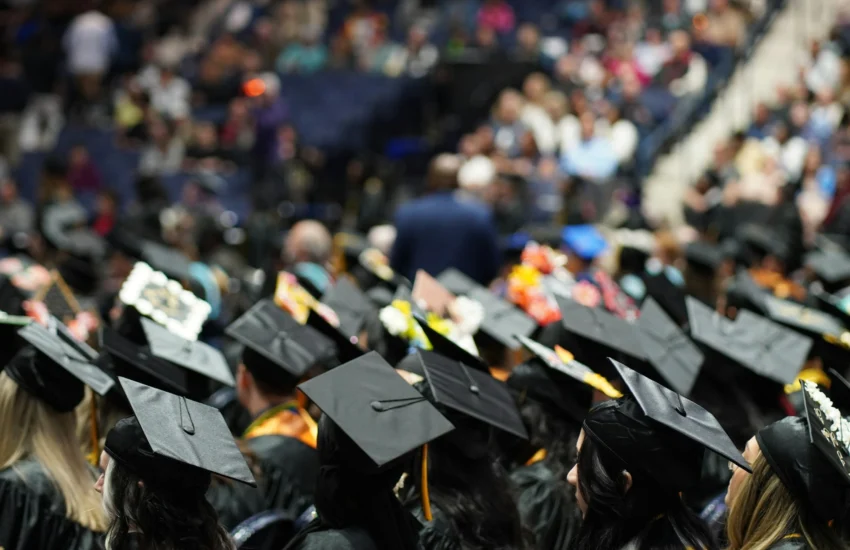 Close-up of diverse students wearing graduation caps, symbolizing scholarship opportunities for US college students in 2025